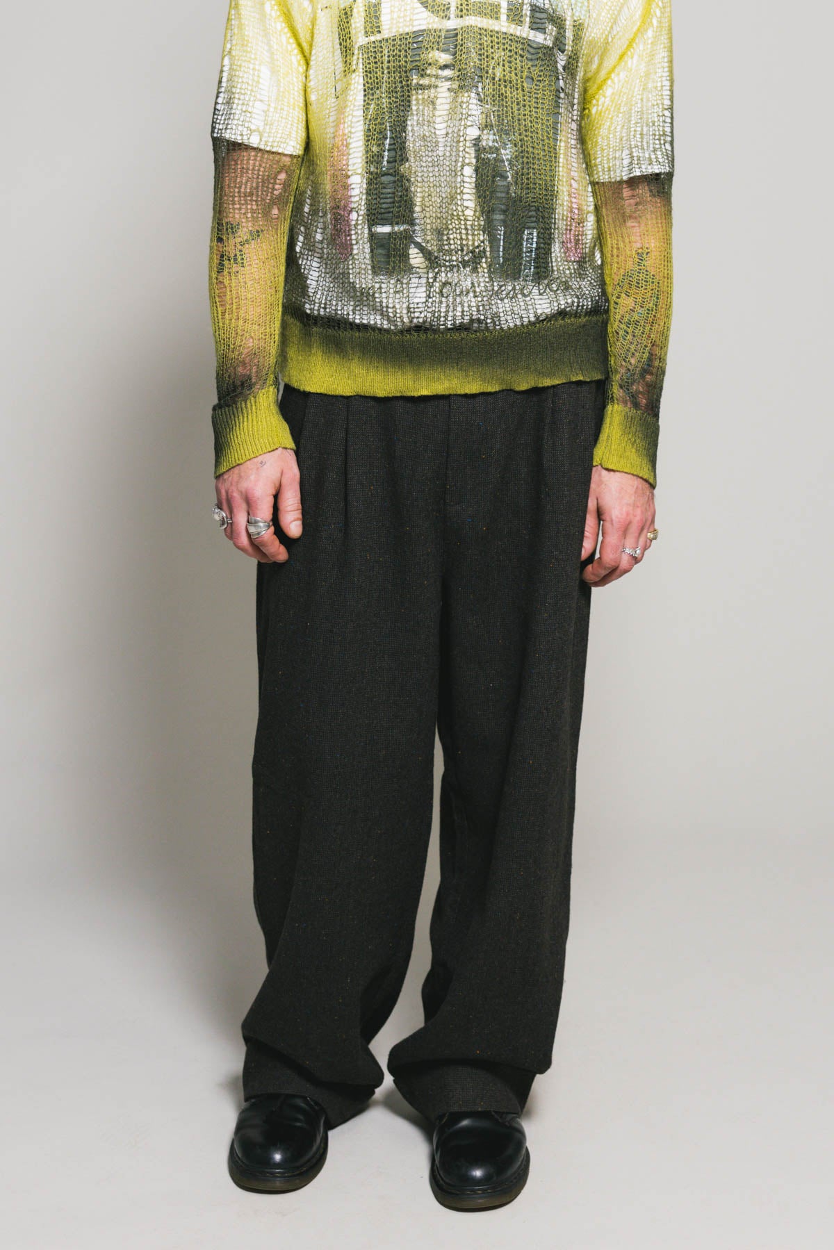 Model wearing the Johnny Distressed Knit Sweater in Green Spray, styled front view